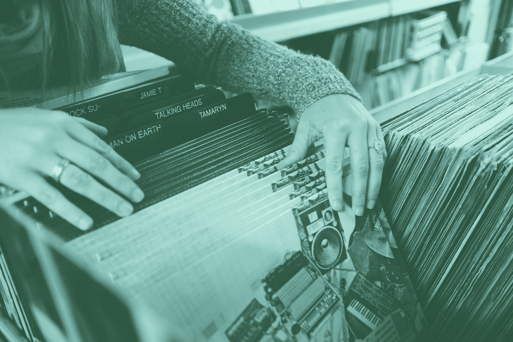 Woman Going Through Some Vinyl Records